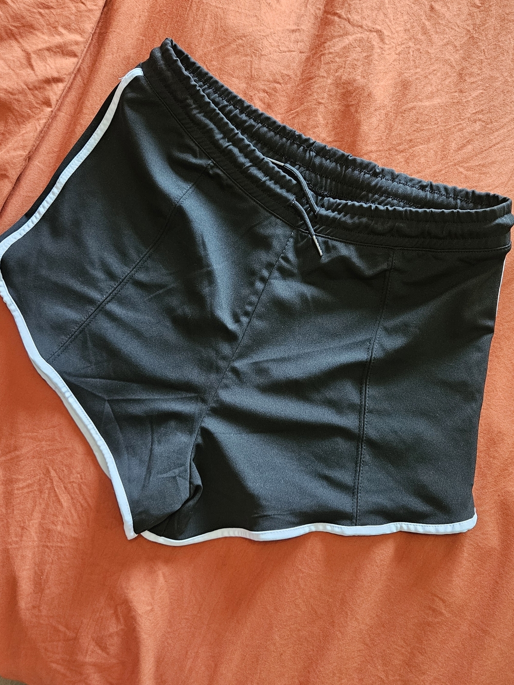 Poof! Black Athletic Shorts with White Trim